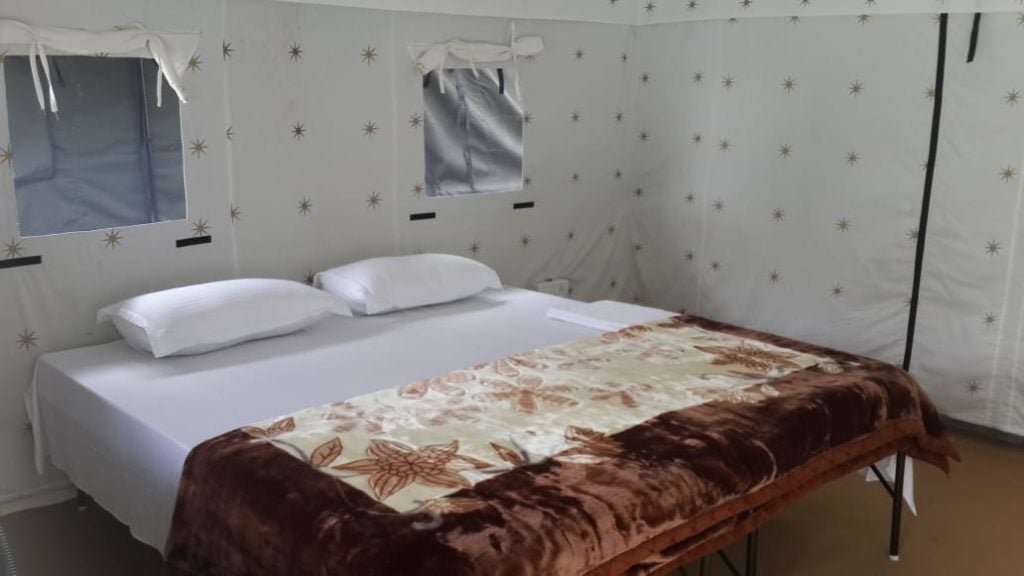 Inside view containing two beds in Mussoorie Camp Resort