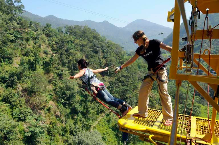 Girl doing bungee jumping at rishikesh
